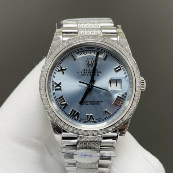 Sunday calendar series women's watch, ice blue dial, diamond-set bezel, 36mm, diamond-set silver President-style bracelet.